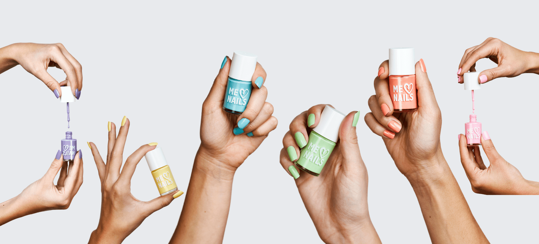 Six hands holding up the six nail polishes from the ME Nails collection.